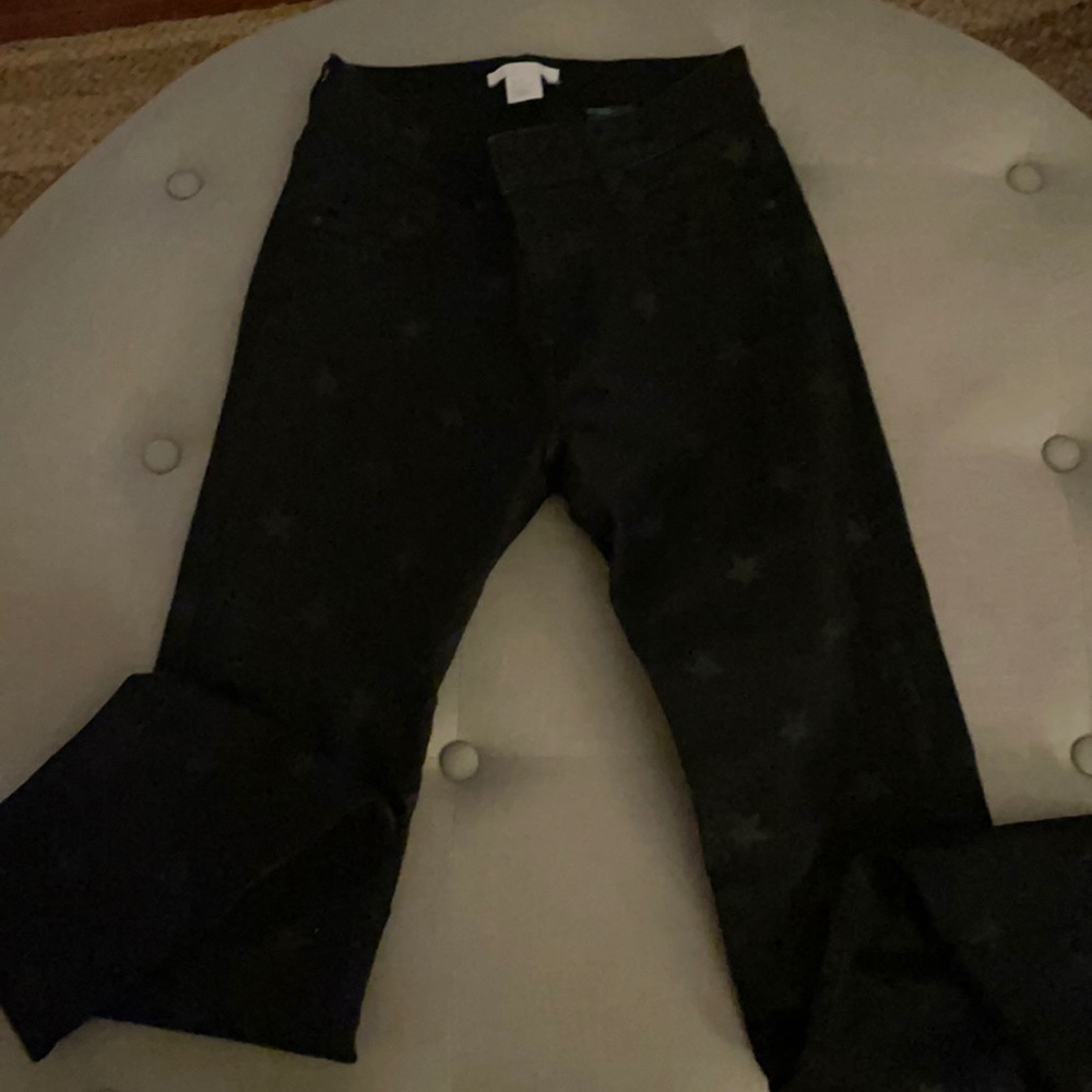 H&M Black skinny jeans with stars. So cute!!